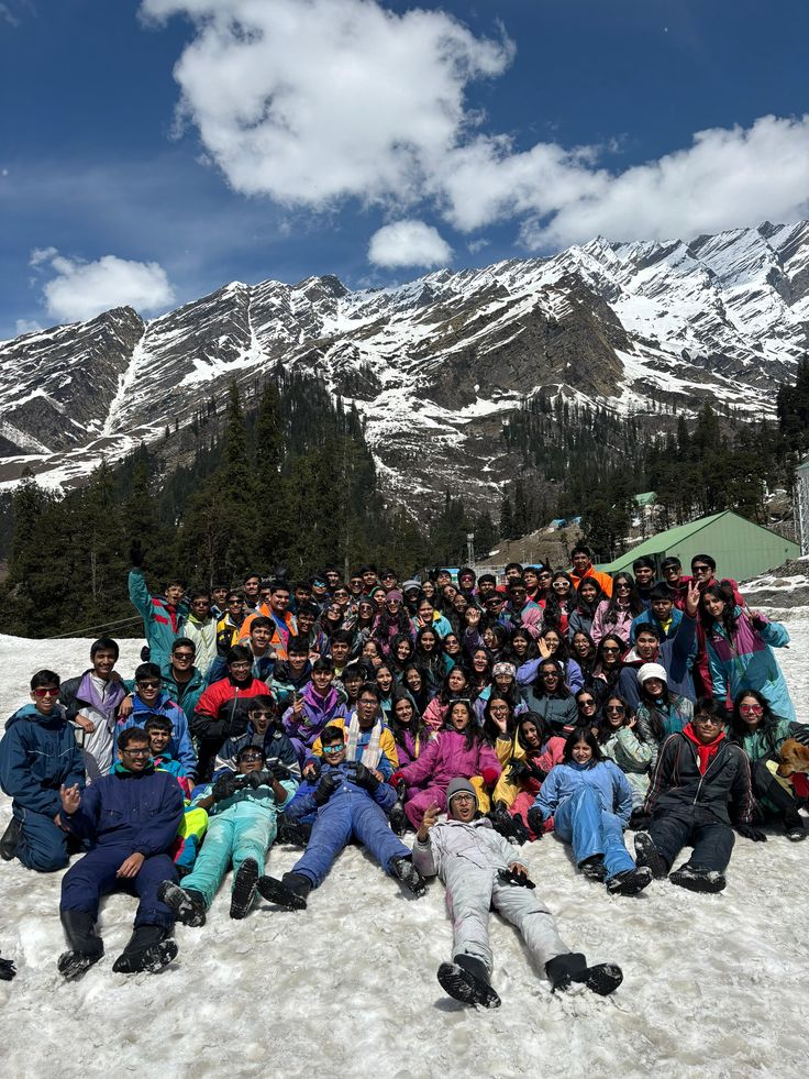 Team posing in the snow during a mountain offsite