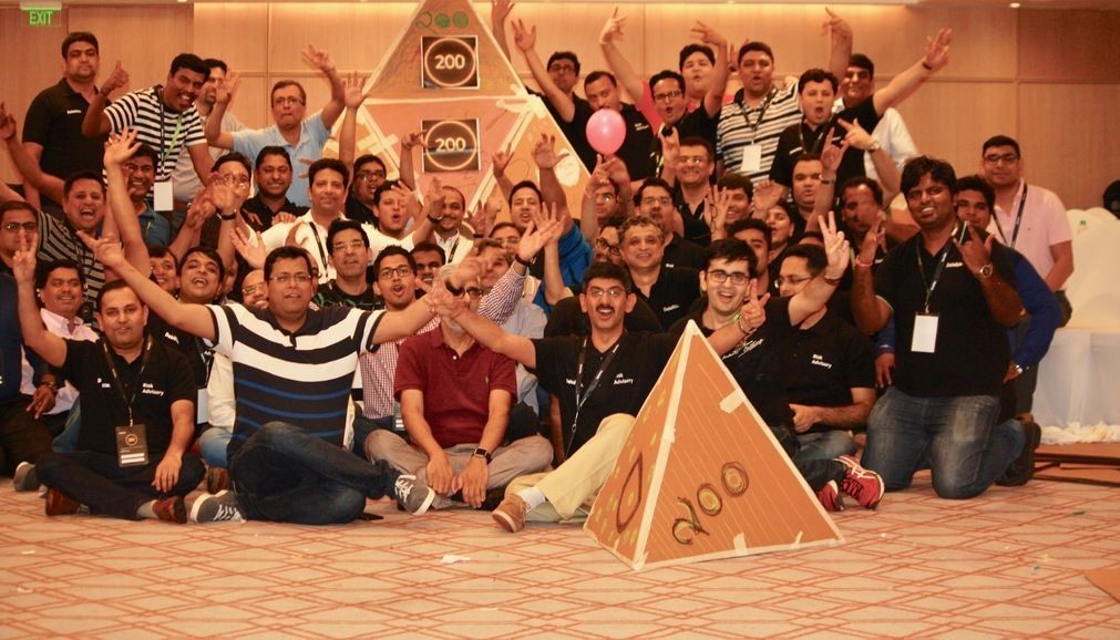 Team celebrating a milestone at an indoor offsite